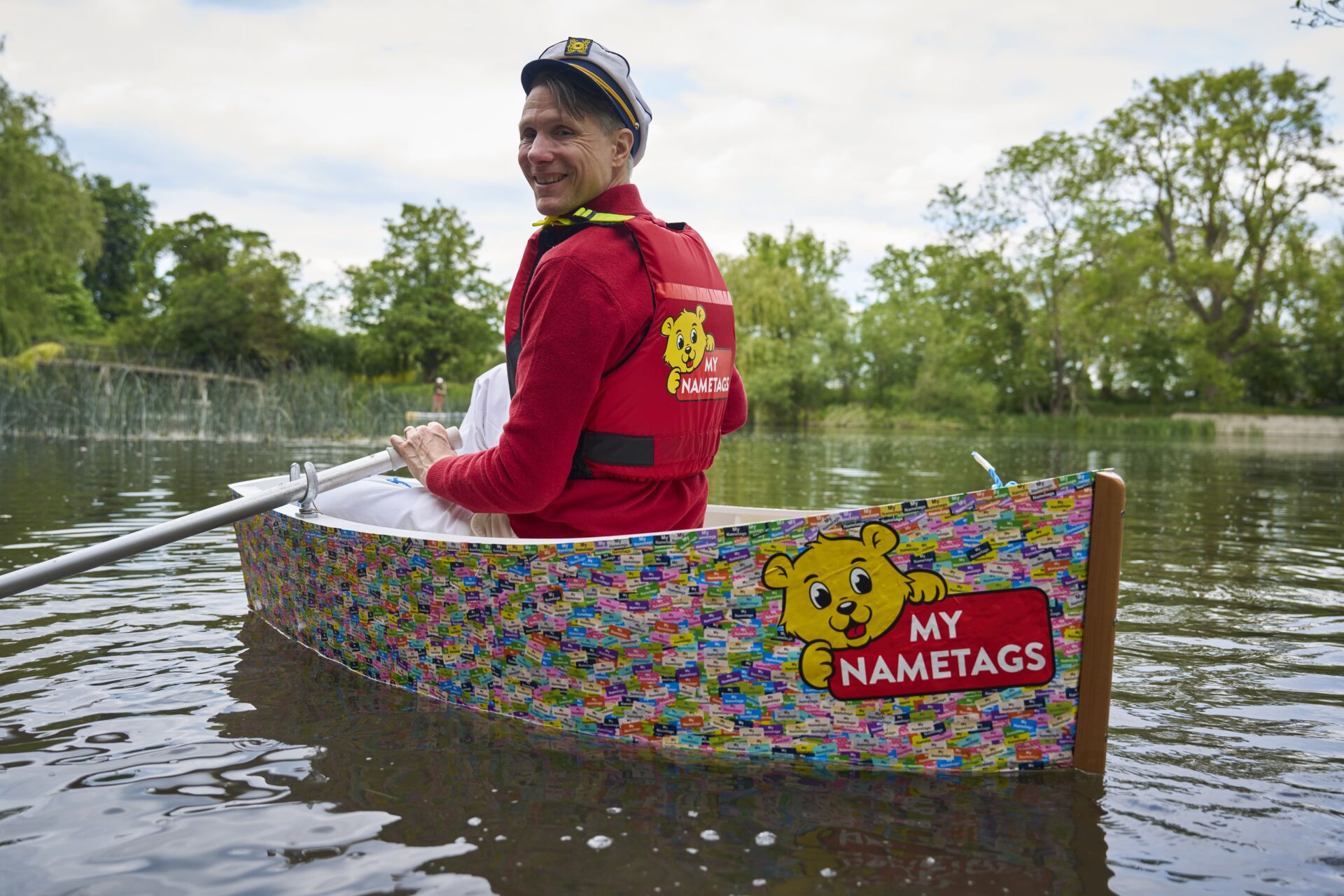 A rowing boat covered entirely in My Nametags waterproof name labels afloat on the River Thames