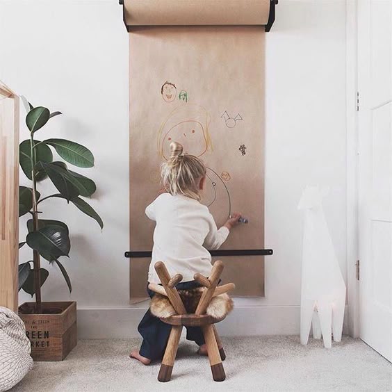 A drawing board on a child's bedroom wall