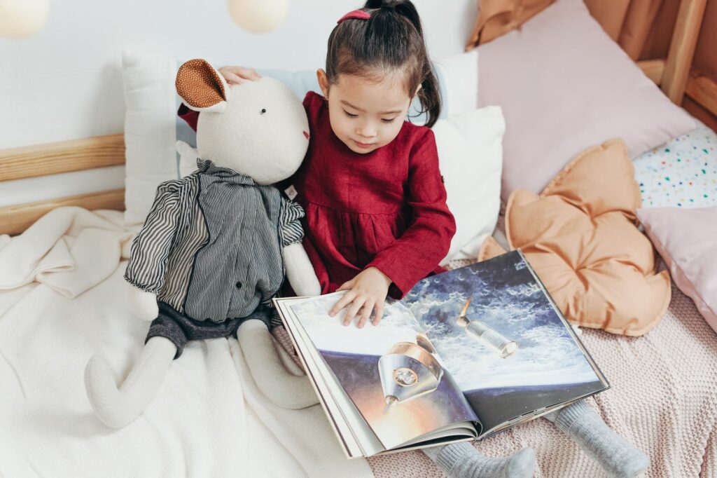A child sitting in their bedroom