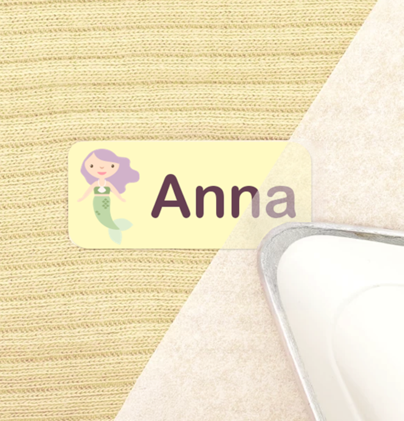 An iron pressing a personalised name label onto fabric