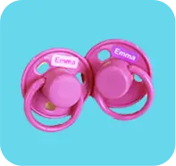 pink pacifier with name sticker