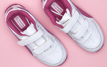 Shoe name labels on white and pink trainers
